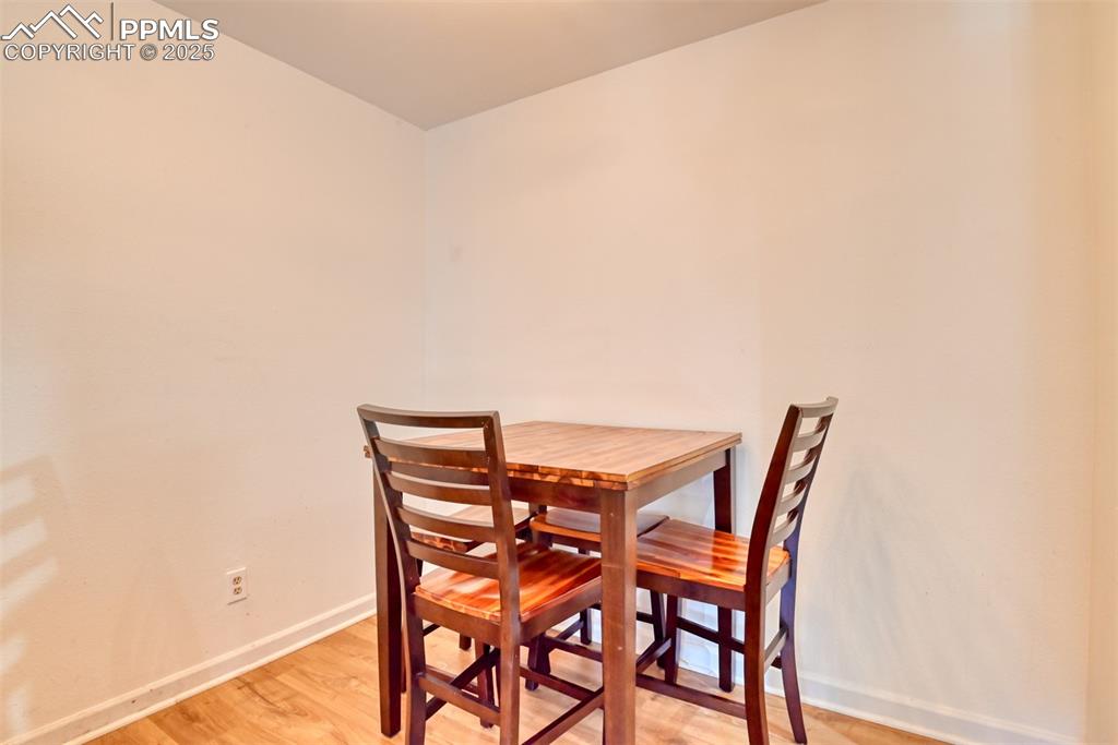 Image 11 of 31: Dining room with baseboards and light wood-style floors