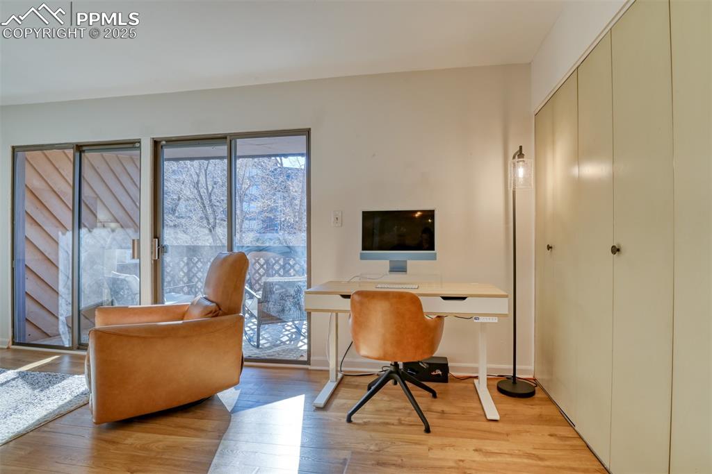 Image 14 of 31: Home office with light wood-style flooring