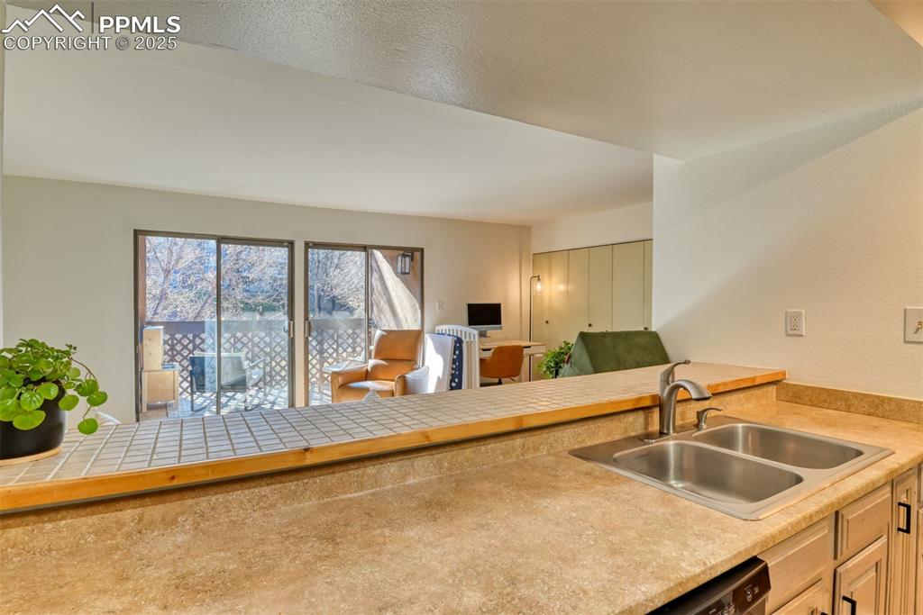 Image 8 of 31: Kitchen featuring open floor plan and light countertops