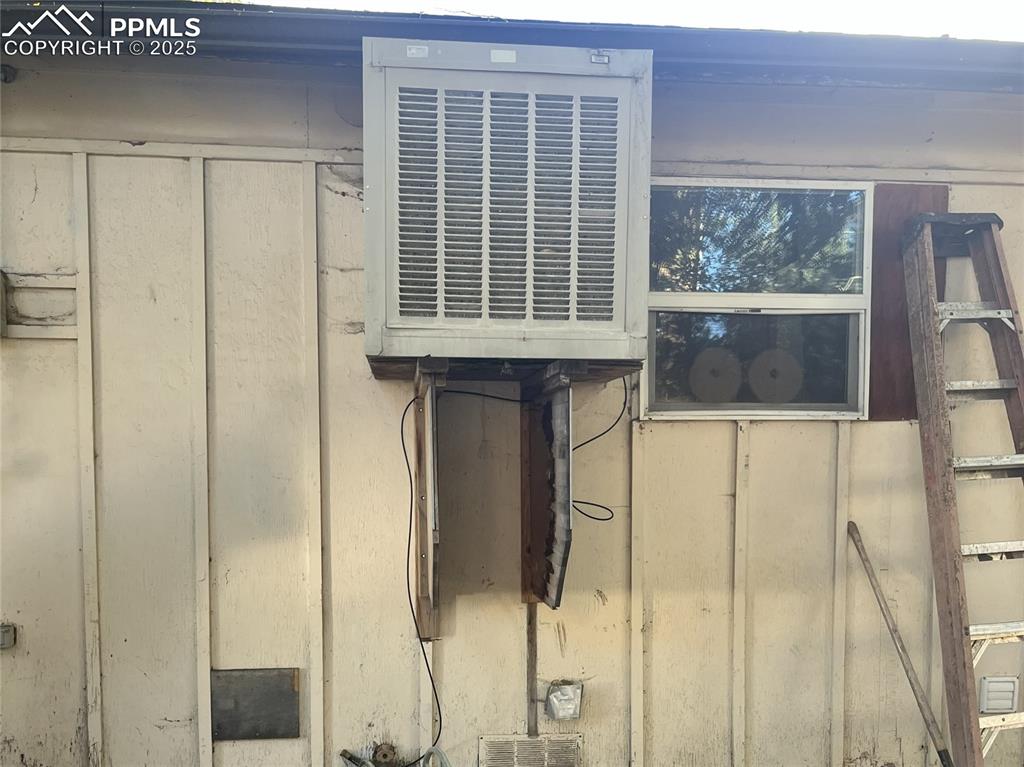 Image 10 of 20: Swamp cooler on back of house.