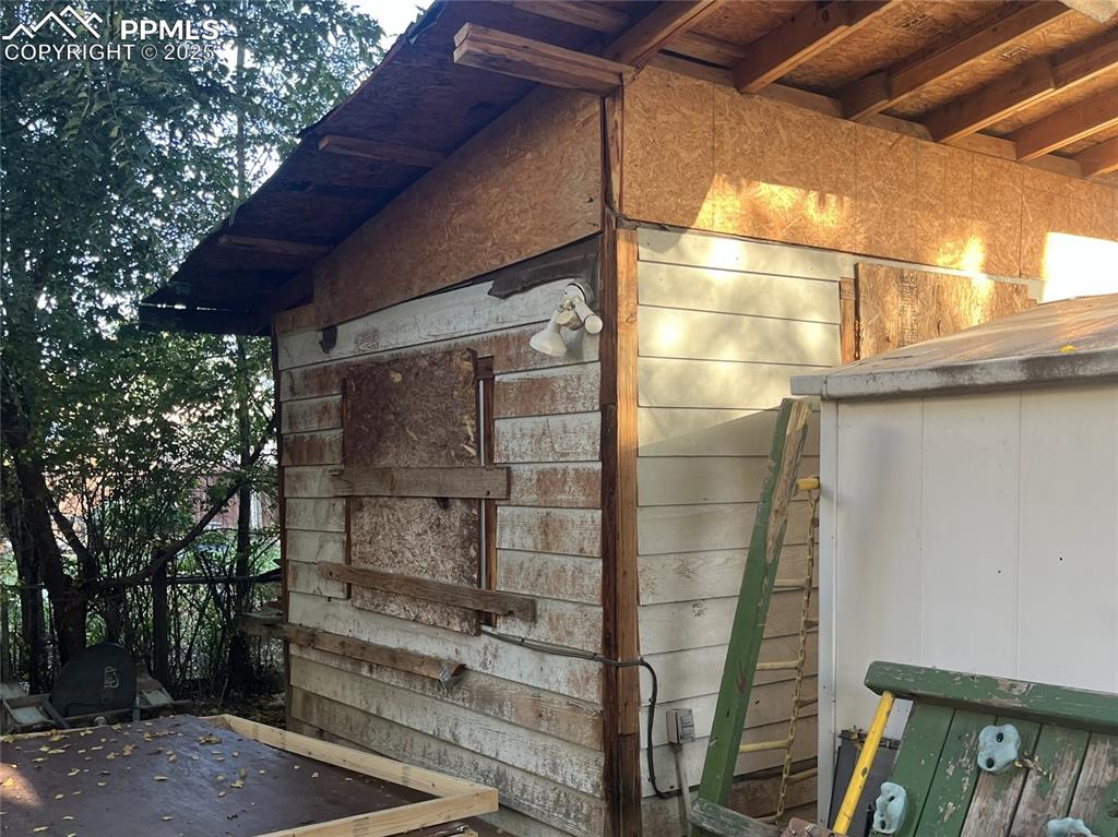 Image 18 of 20: Two storage sheds - west side.