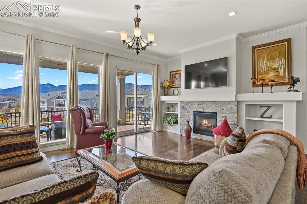 Image 16 of 50: Beautiful Fireplace and Electric shades