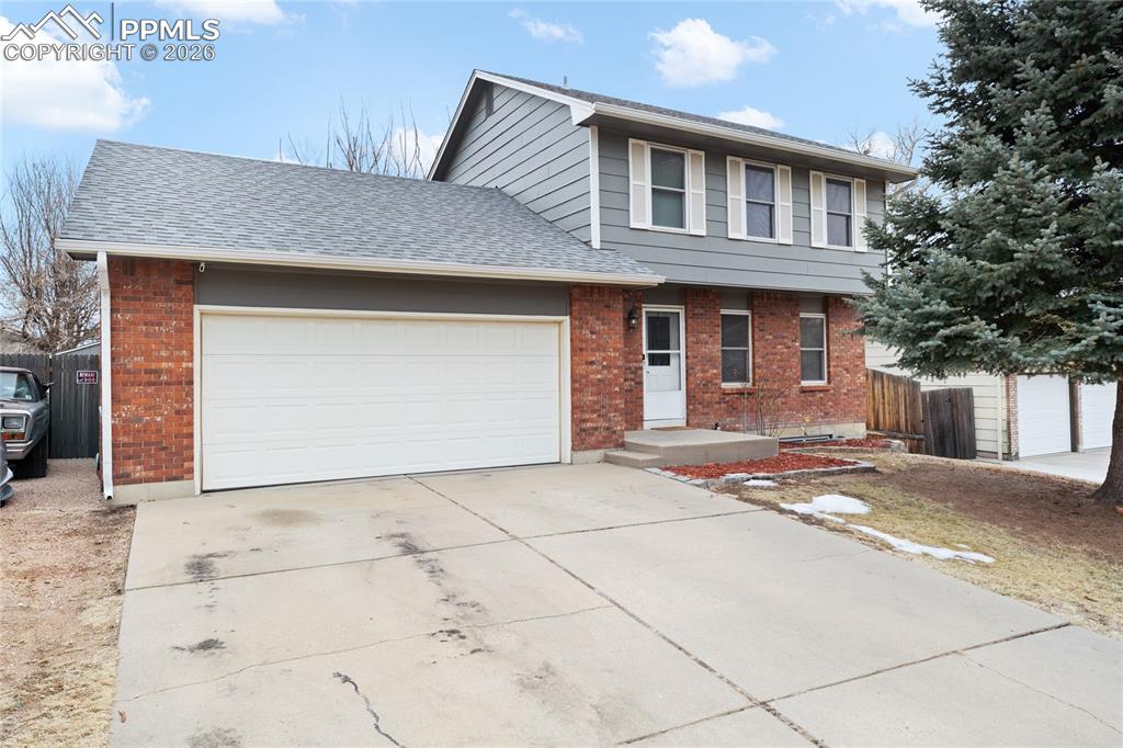 Caption: Oversized 2.5 car garage w RV parking