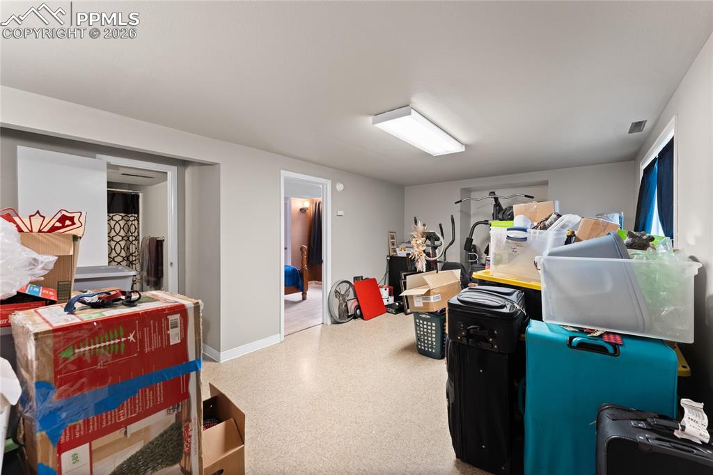 Image 20 of 30: Basement family room w wet bar rough-in. Ignore the boxes, we are moving!