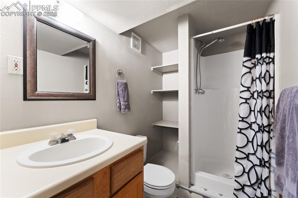 Image 22 of 30: Basement bathroom