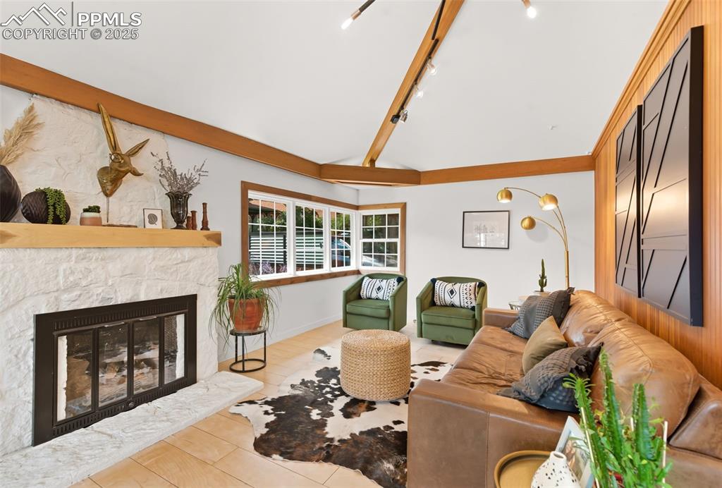 Image 16 of 49: Stone fireplace in the living room