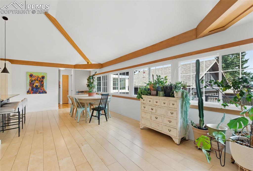 Image 17 of 49: Dining area is open to the kitchen and the living room