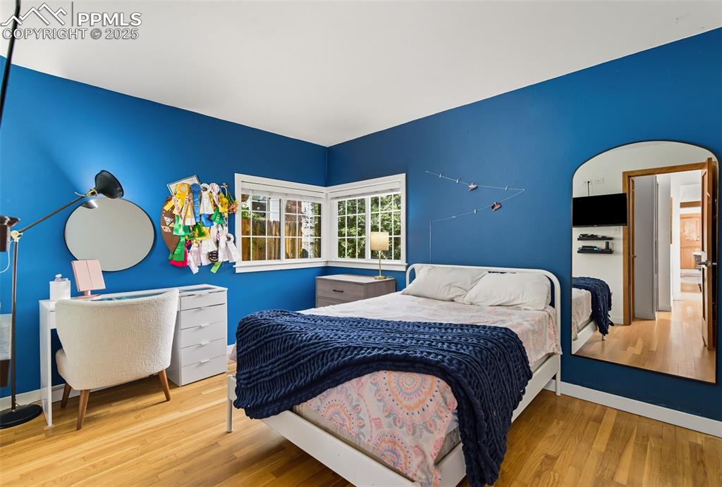 Image 26 of 49: Second bedroom on main floor has plumbing for a 3/4 bath in the closet floo