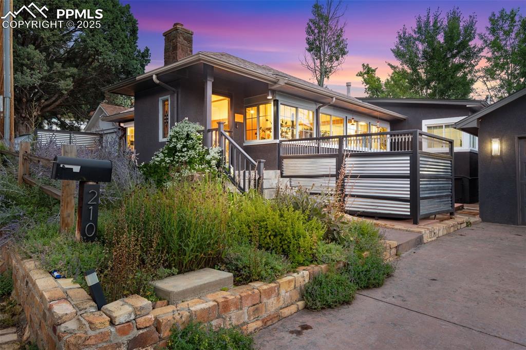 Image 8 of 49: The hot tub is behind this fence