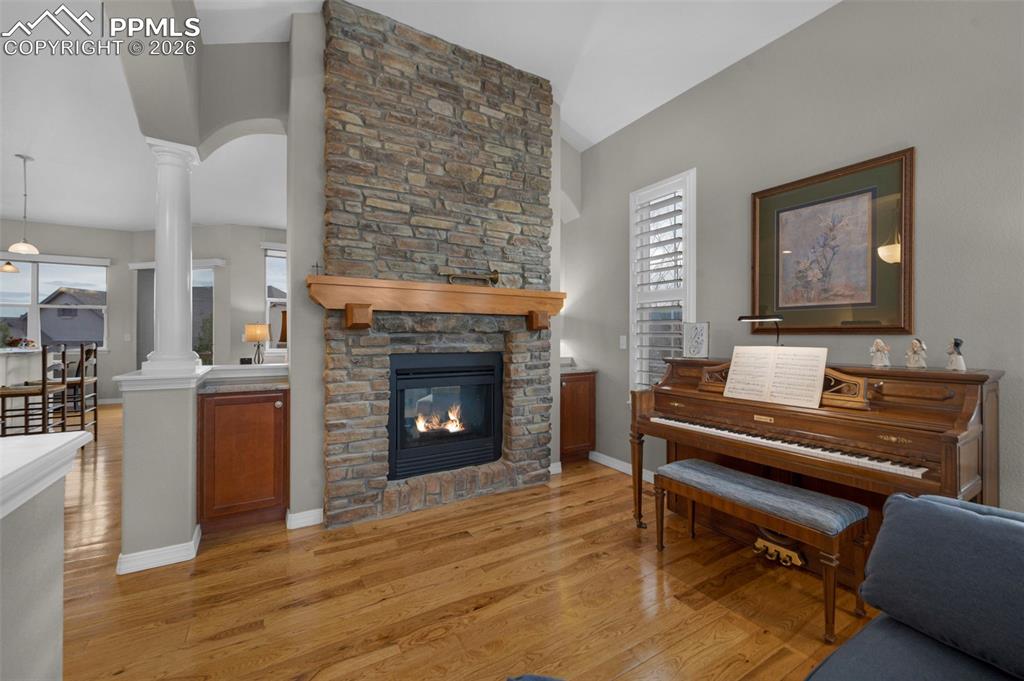 Image 19 of 50: Hickory floors, double-sided fireplace