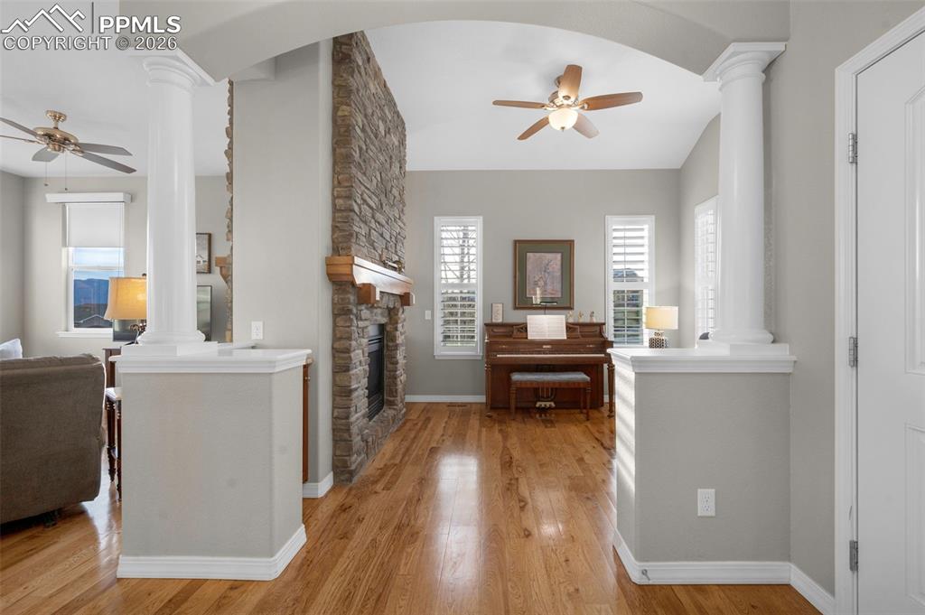 Image 20 of 50: Hickory floors, double-sided fireplace