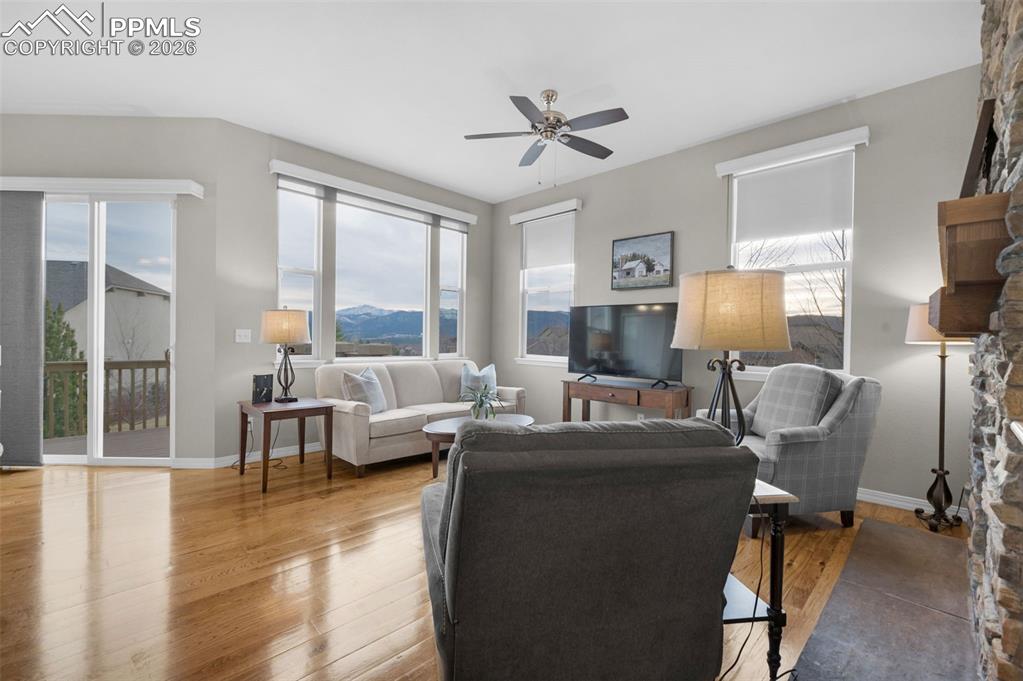 Image 8 of 50: Hickory floors, double-sided fireplace