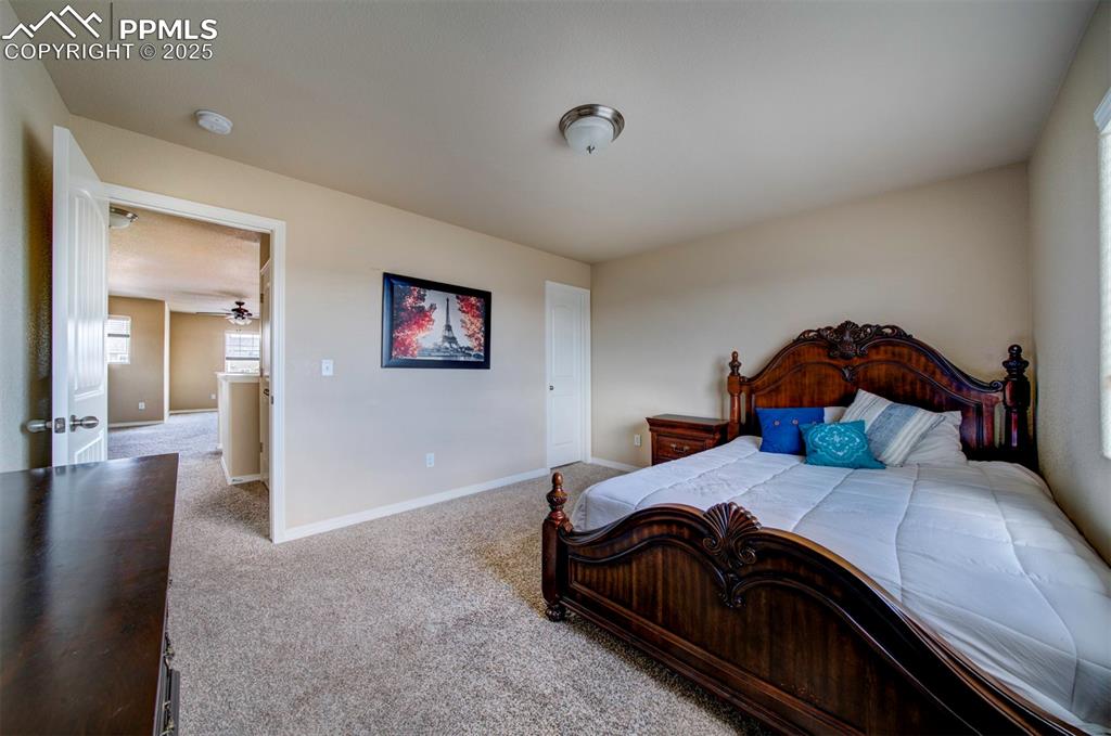 Image 29 of 46: Carpeted bedroom featuring baseboards