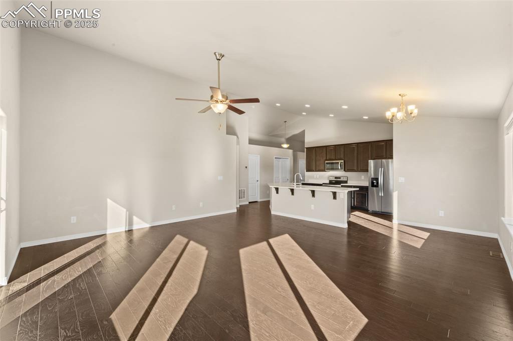 Image 19 of 39: Family game night? Movie marathons? This living room is up for it.