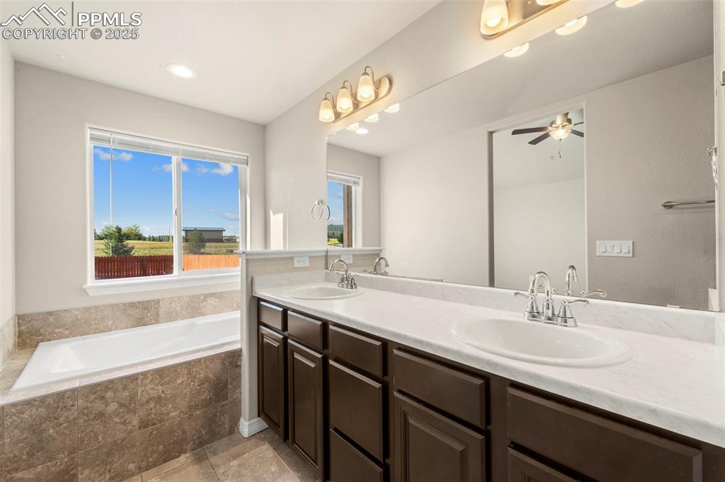 Image 25 of 39: A secondary bathroom that’s just as stylish as the first.