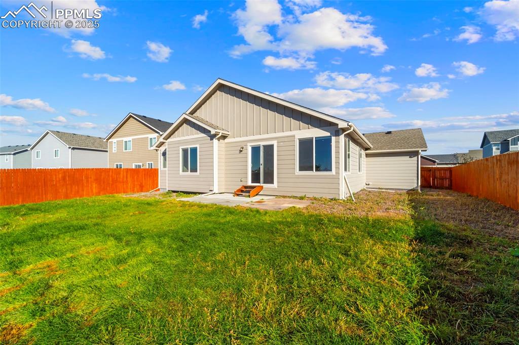 Image 30 of 39: Wide backyard view: space for pets, play, and plenty of fun.