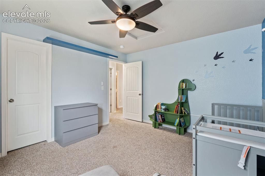 Image 30 of 42: Carpeted flooring, ceiling fan with integrated lighting, and multiple panel