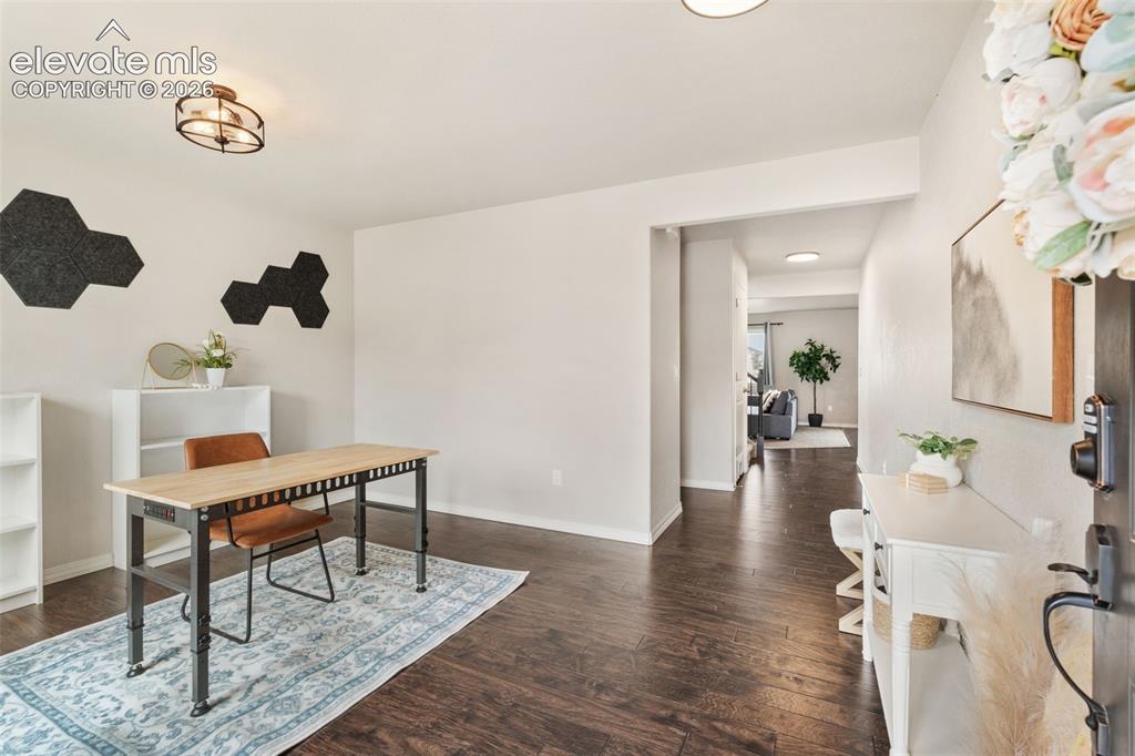 Image 5 of 42: Wood-finish flooring throughout, bright white walls, and recessed lighting
