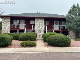 Caption: View of front facade featuring stone siding