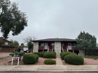 Image 2 of 6: View of front of property with stone siding