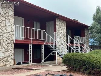 Image 6 of 6: View of property with stairway