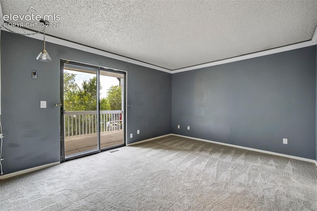 Image 17 of 49: Primary bedroom with a walkout to the upper deck