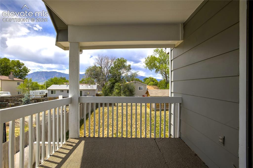 Image 39 of 49: Upper deck with views of Pikes Peak and Cheyenne Mountain