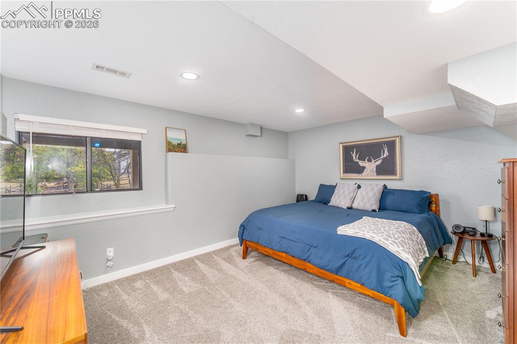Image 32 of 49: Basement Bedroom