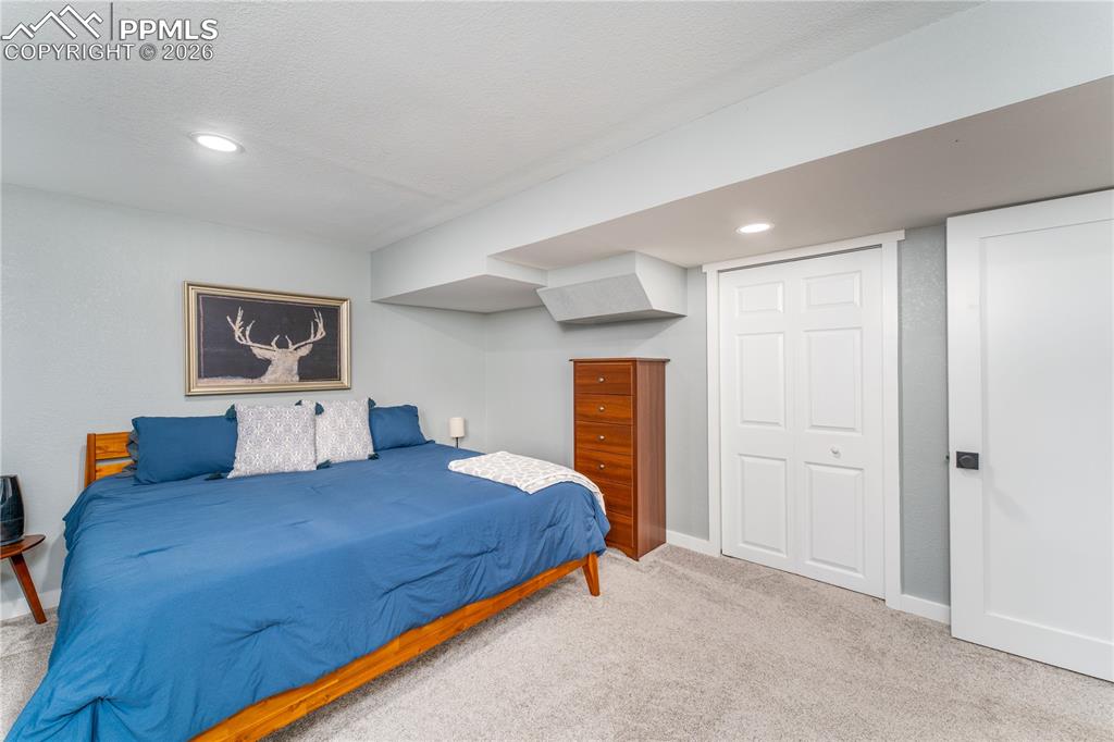 Image 33 of 49: Basement Bedroom