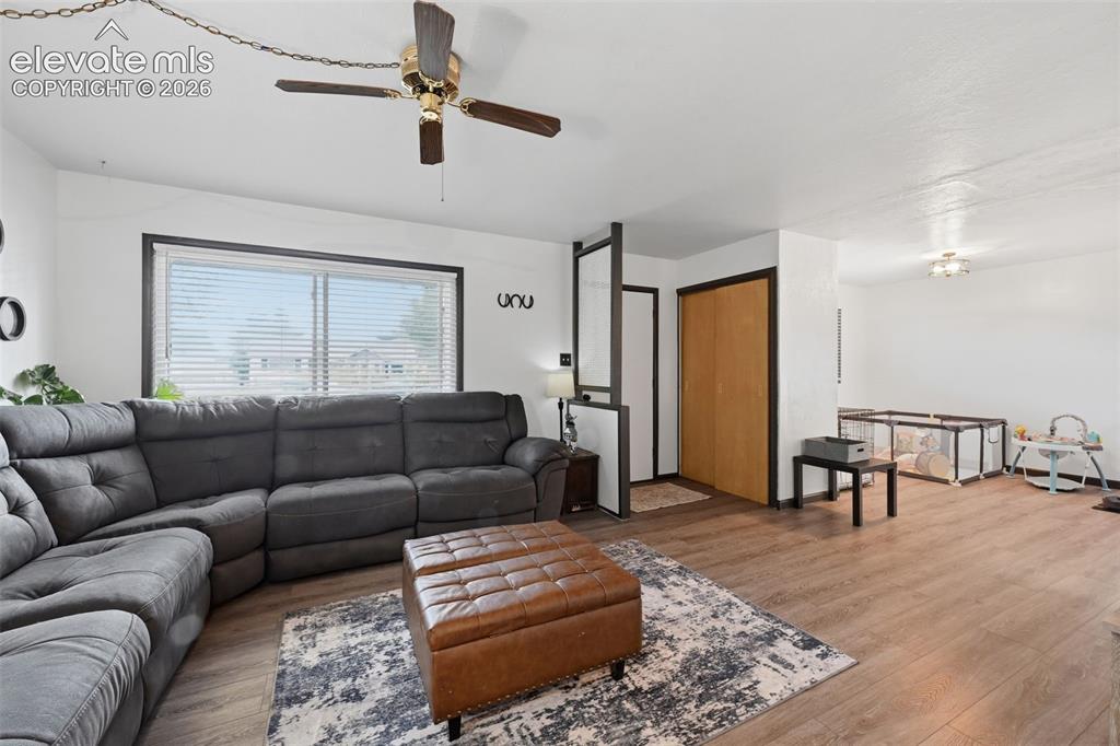 Image 11 of 30: Living Room and Dining Room