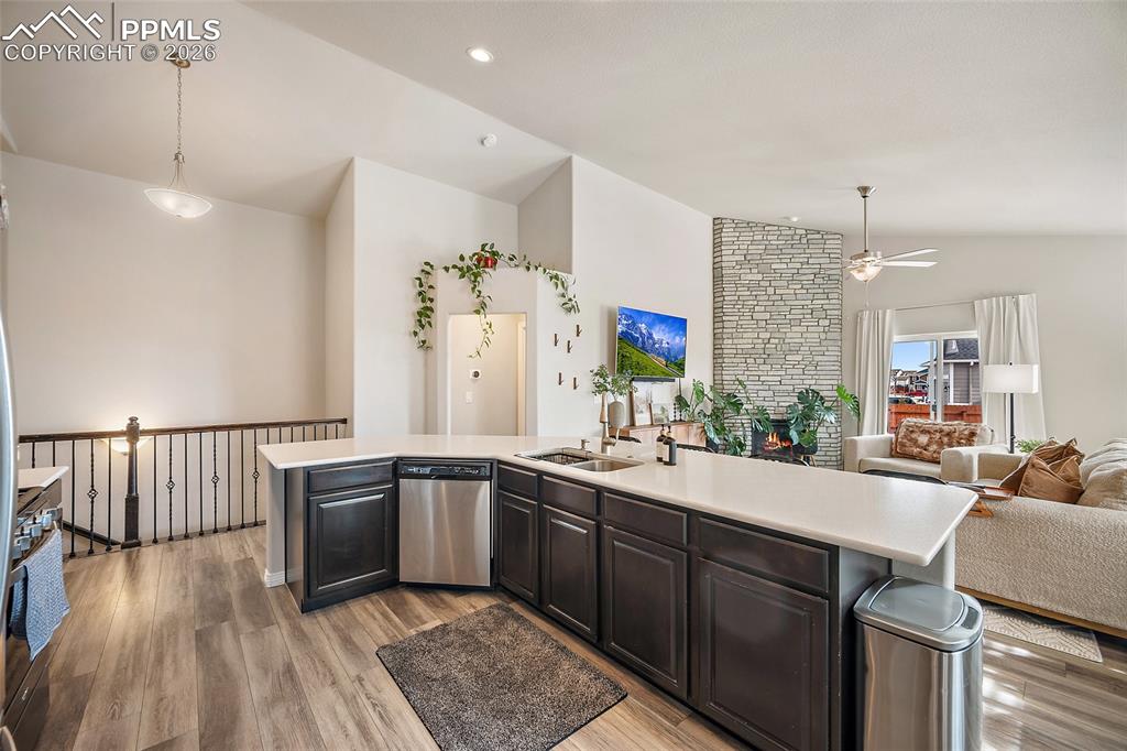 Image 12 of 43: Kitchen featuring lofted ceiling, open floor plan, stainless steel applianc