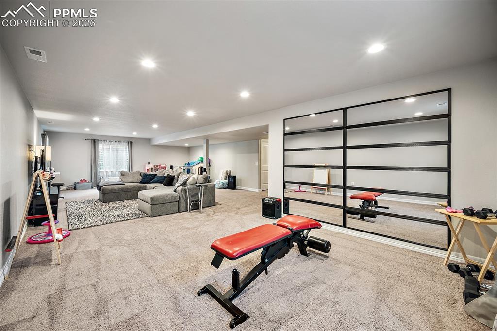 Image 35 of 43: Exercise room with carpet and recessed lighting