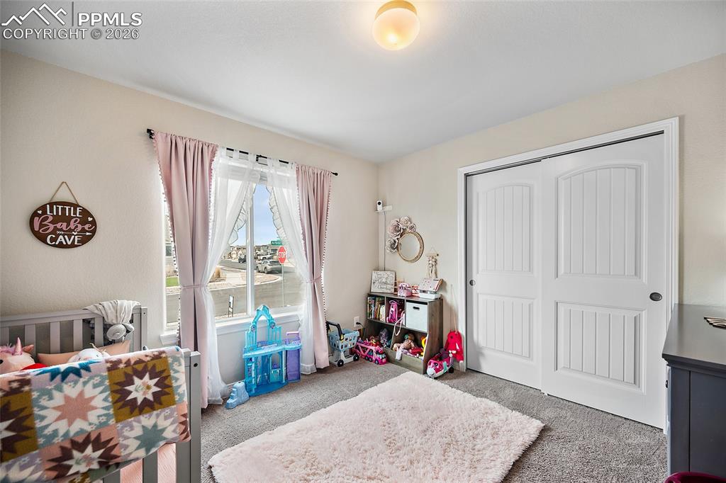 Image 9 of 43: Bedroom with carpet and a closet