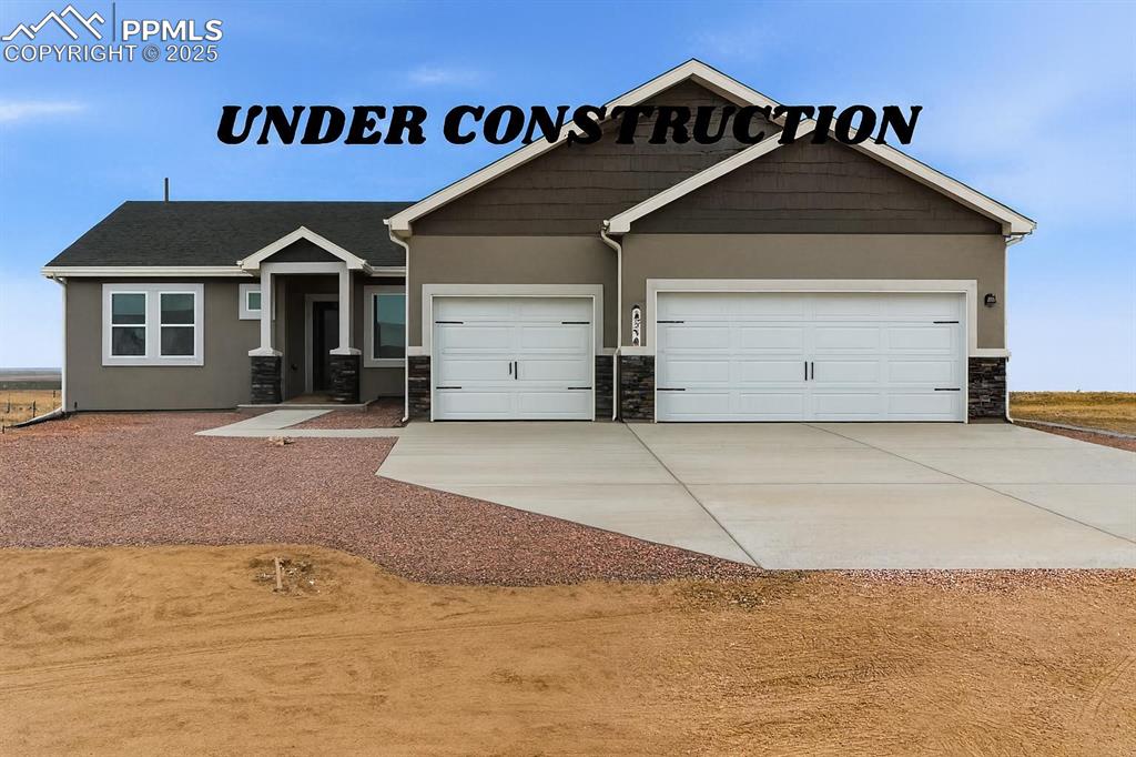 Caption: Craftsman-style house with concrete driveway, stone siding, an attached garage, and stucco siding