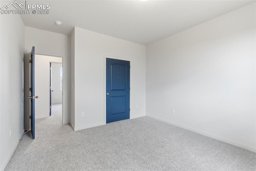 Image 14 of 26: Unfurnished bedroom featuring carpet floors and baseboards