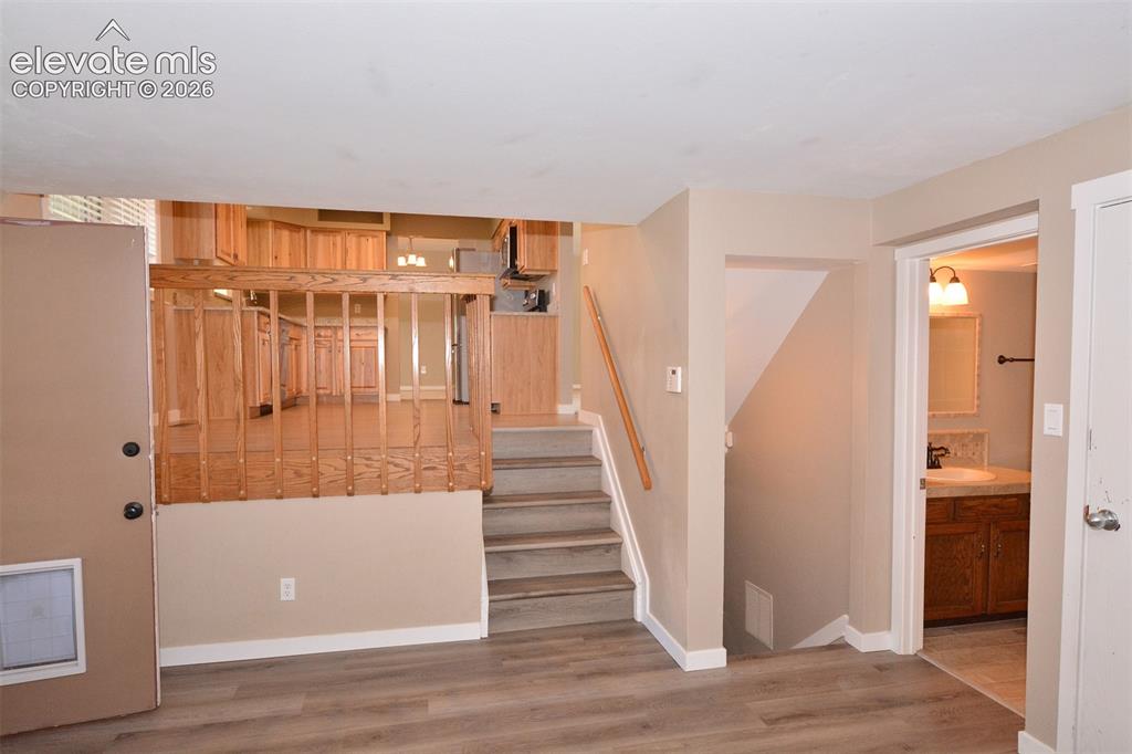 Image 13 of 33: Stairway to the lower level