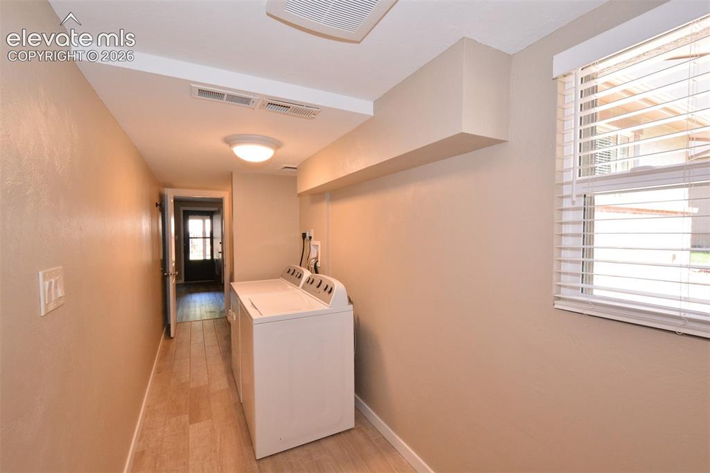 Image 18 of 33: laundry space in lower level full bathroom