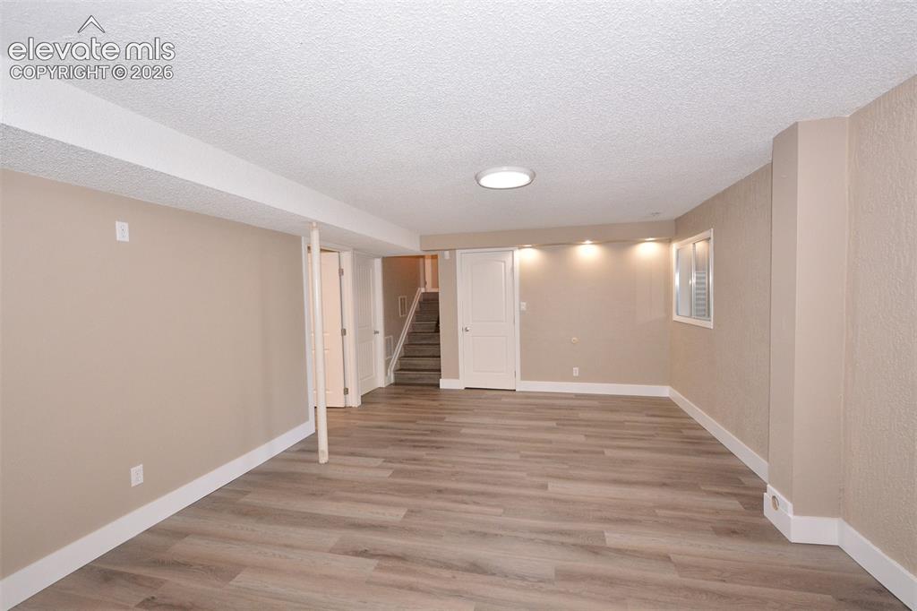 Image 19 of 33: Large room that can be used as a rec room, office, etc in the basement