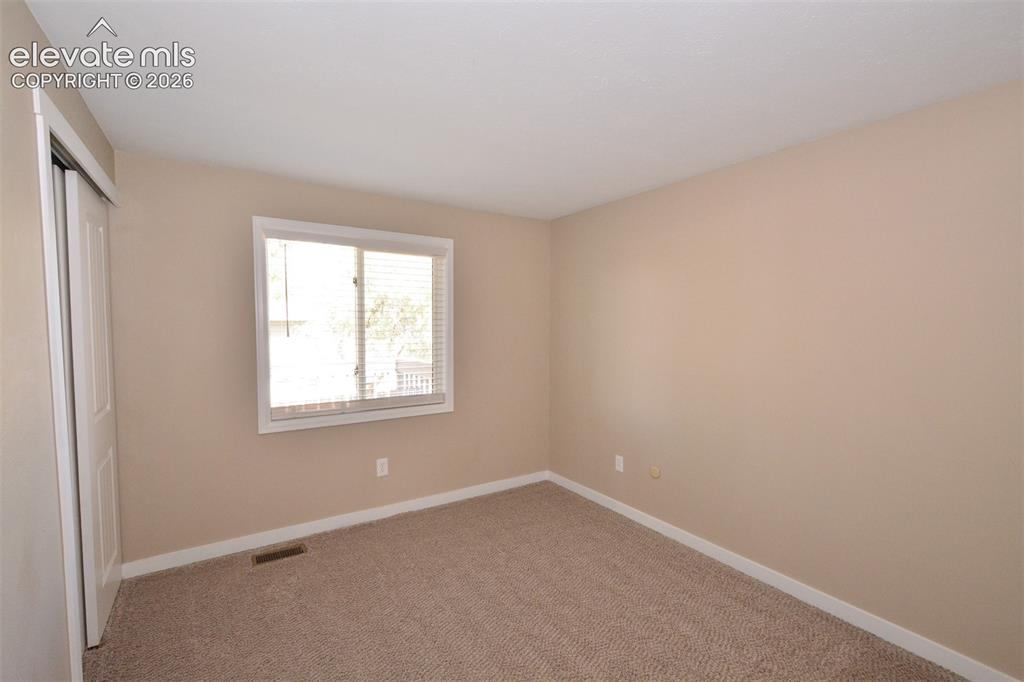 Image 21 of 33: Bedroom on upper level