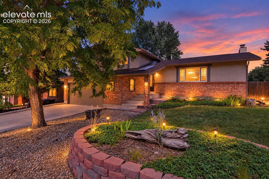 Image 3 of 33: Twilight of front of home