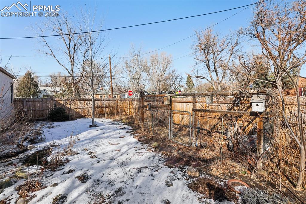 Image 40 of 48: Backyard with garden area