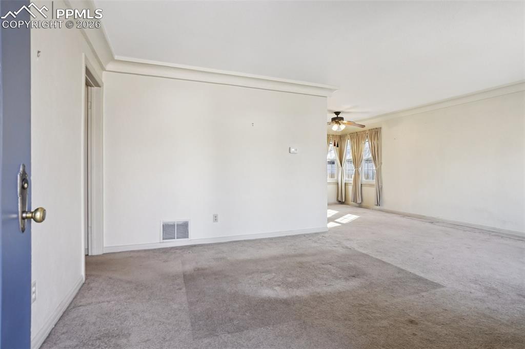 Image 5 of 48: Spacious and naturally lit living room