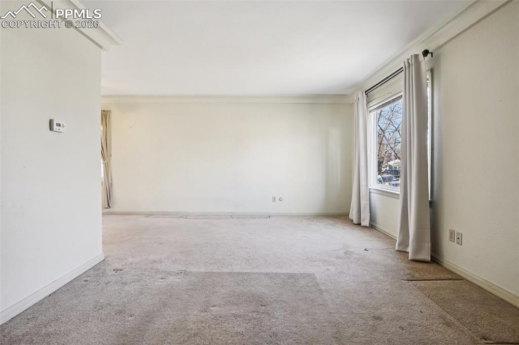 Image 6 of 48: Spacious and naturally lit living room
