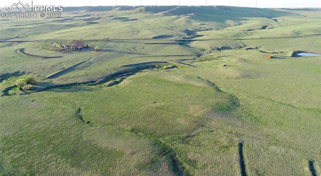 Caption: Aerial view of property and surrounding area with rural landscape