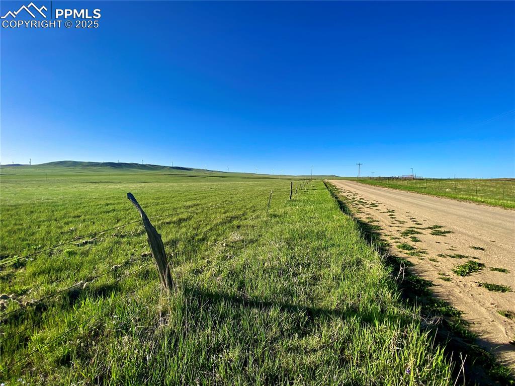 Image 8 of 8: View of dirt / gravel road with a view of rural / pastoral area