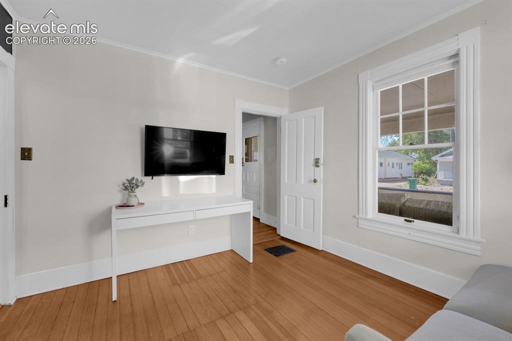 Image 18 of 32: Main level bedroom 