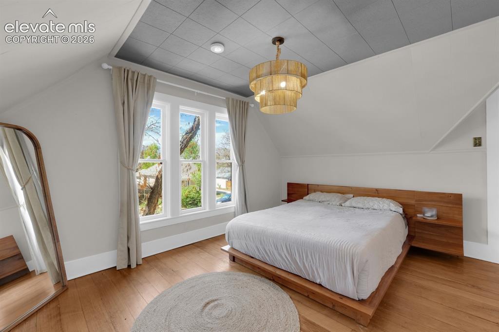 Image 19 of 32: Upper level bedroom with walk-in closet