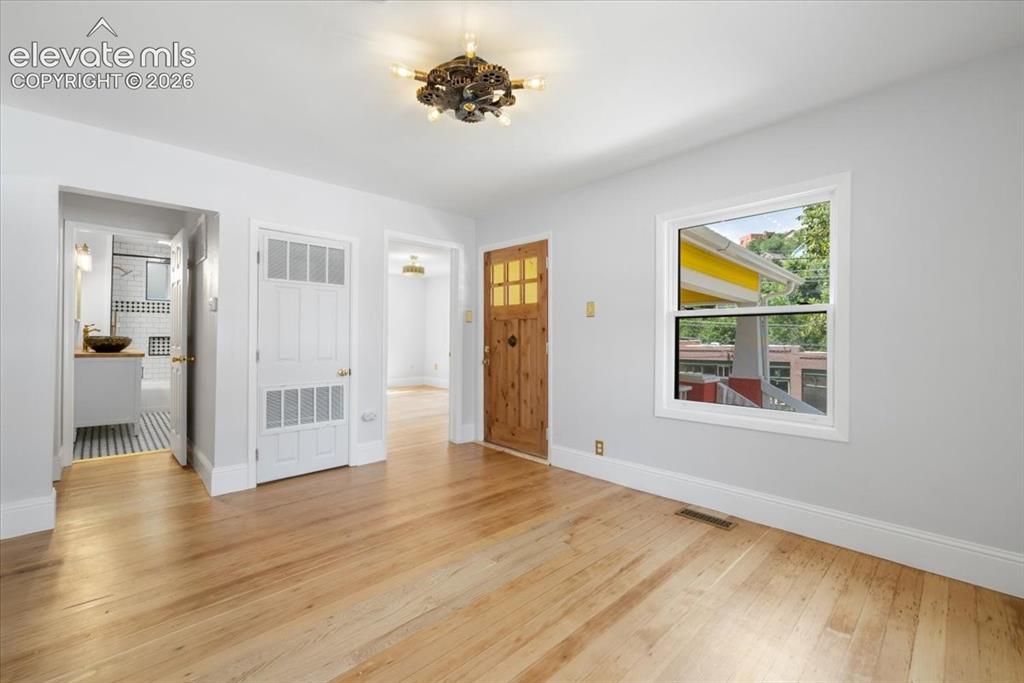 Image 11 of 30: Living area overlooks Ruxton Ave.