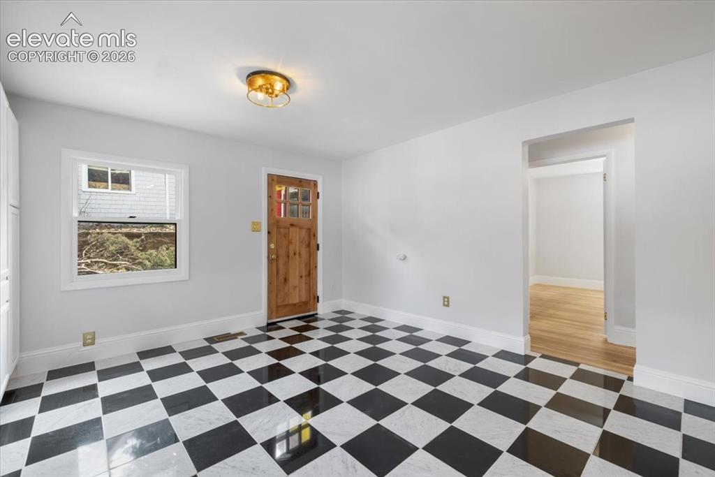 Image 8 of 30: Eat-in kitchen with door to back patio
