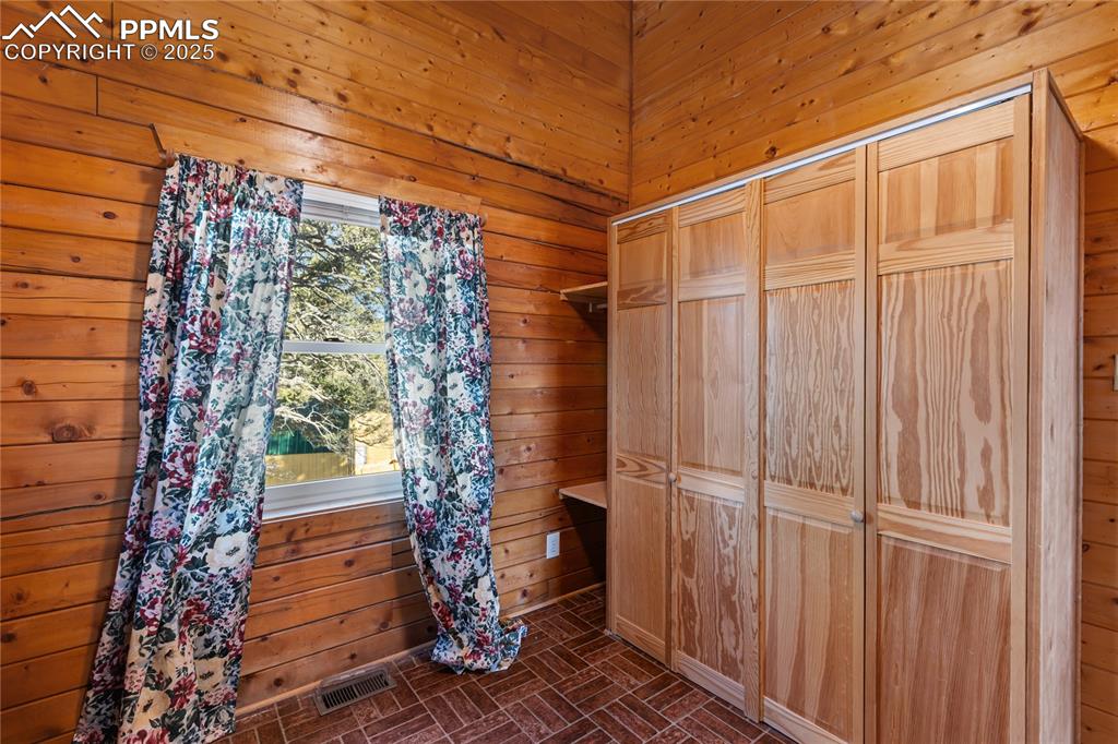 Image 22 of 33: View of walk in closet